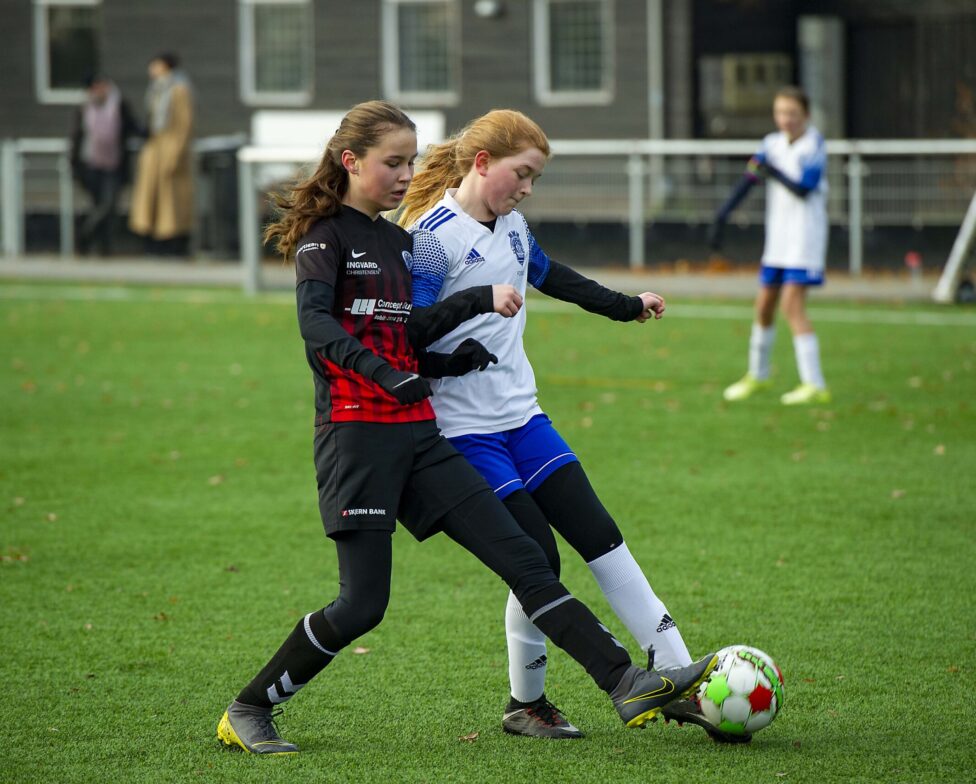 Girls soccer game - tackling